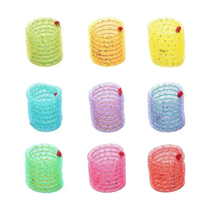 Colorful spiral hair ties with small decorative beads arranged in a 3x3 grid.