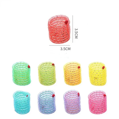 Colorful glittery spiral hair ties arranged in rows showing different pastel shades.