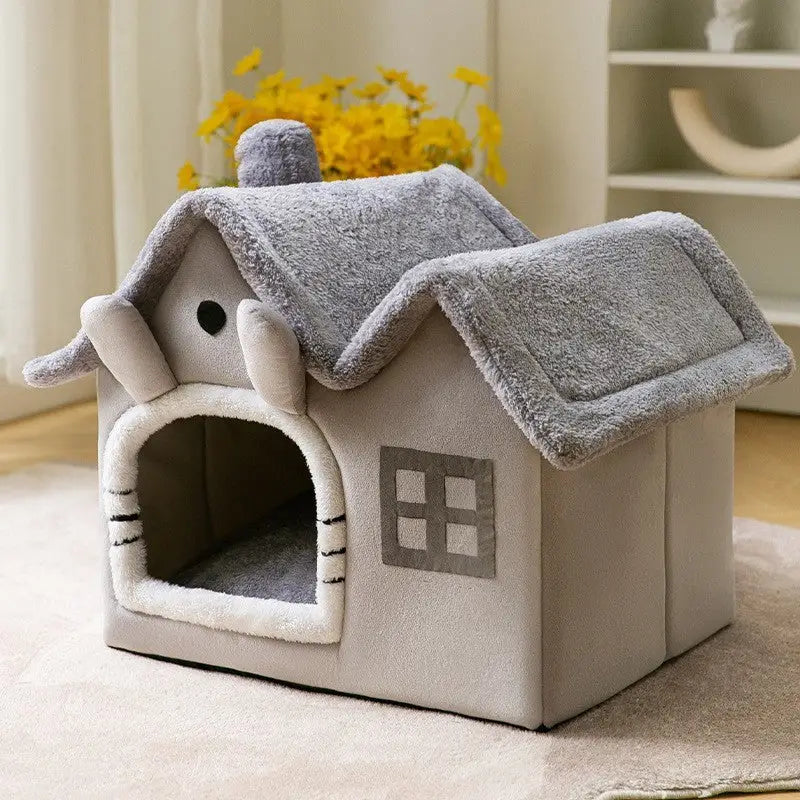 Plush pet house with gray roof and decorative window design.