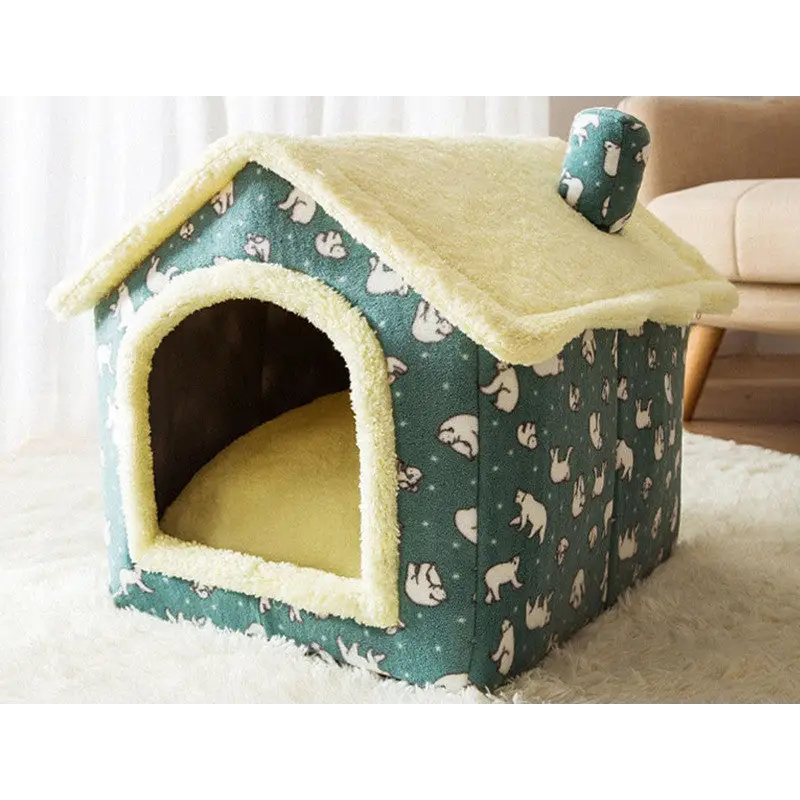 Teal and cream-colored pet house with bunny pattern decorations.