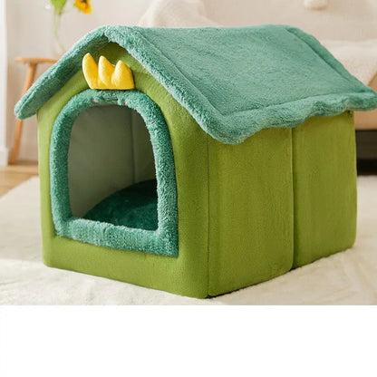 Plush green pet house with a crown decoration on top.