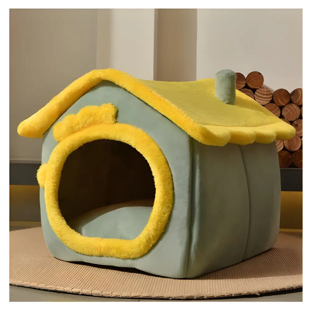 Mint green pet house with yellow trim and a sloped roof.