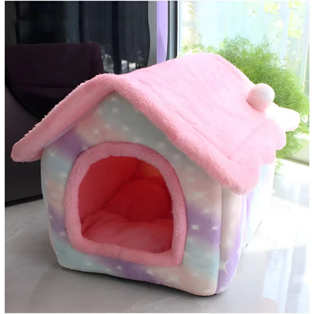 Pink and pastel-colored plush pet house with a pointed roof.