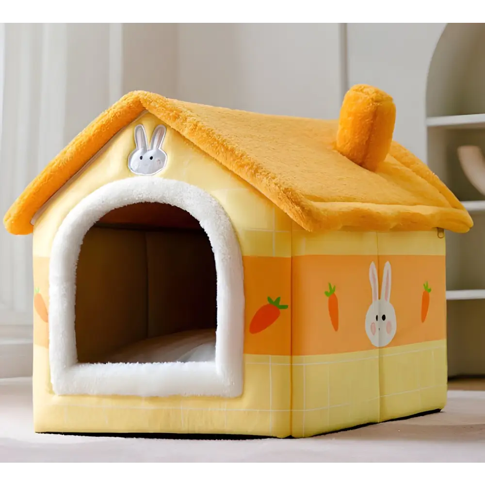 Yellow pet house with bunny and carrot decorations and a white arched entrance.