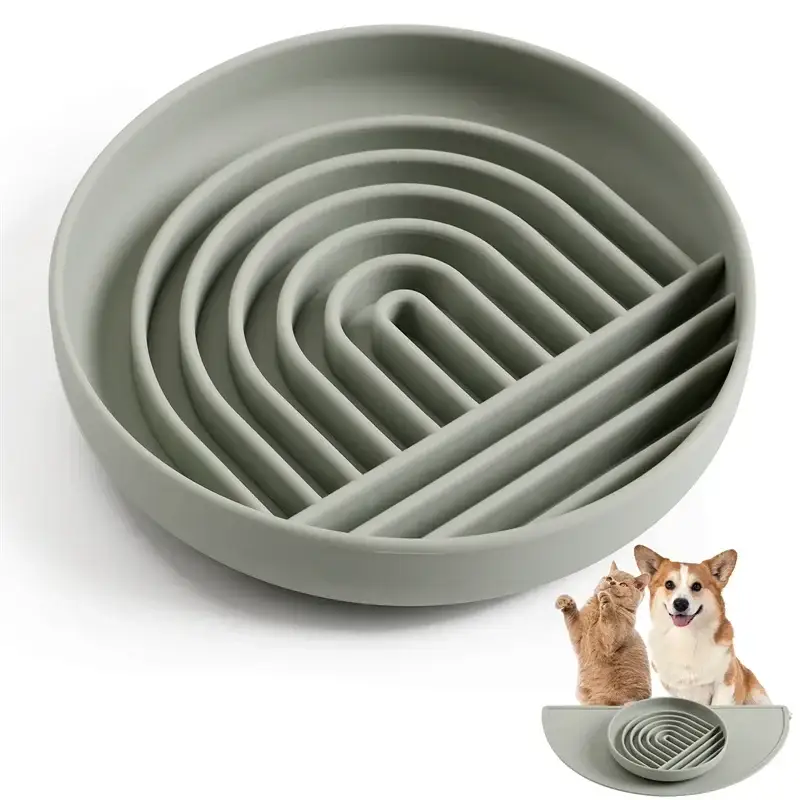 Circular silicone slow feeder bowl with curved maze-like ridges.