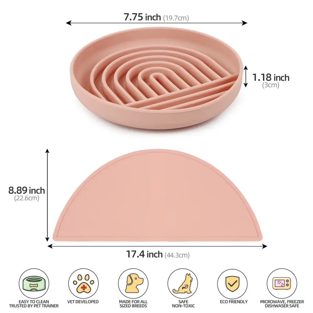 Pink semicircular pet feeding mat with concentric ridges on its surface.