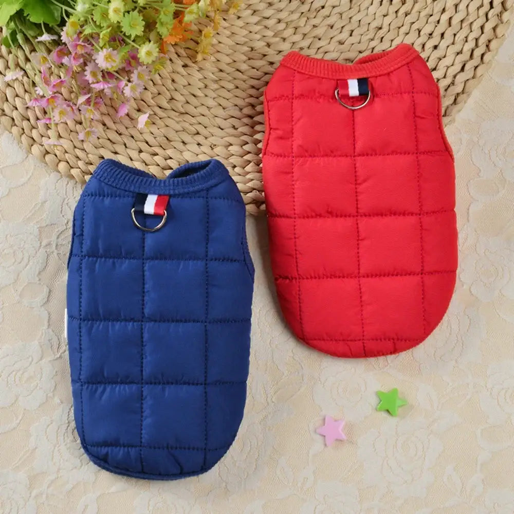 Quilted winter dog vests in red and navy blue.