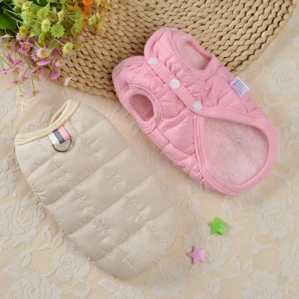 Pink and beige quilted baby slippers.