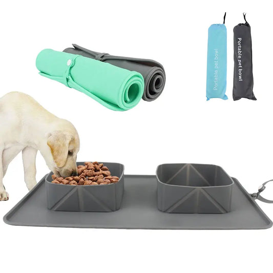 Silicone pet feeding mat with raised bowls and spill-catching tray.