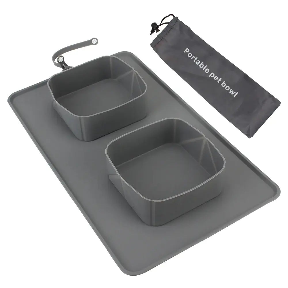 Portable pet feeding mat with two removable bowls and a storage bag.