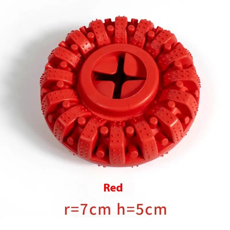 Circular red plastic brush head with textured ridges radiating from the center.