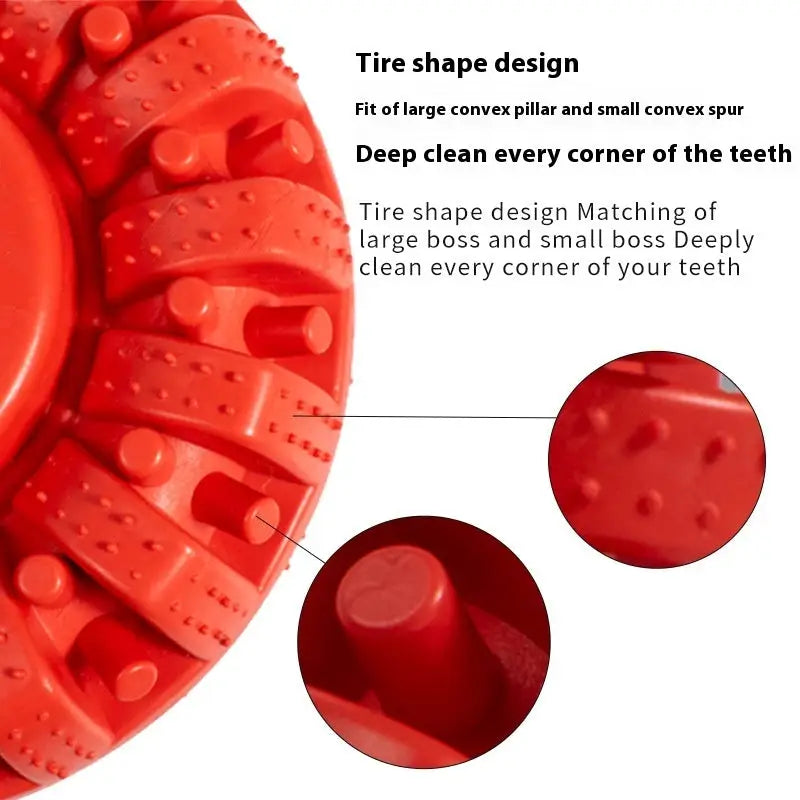 Red rubber dog chew toy with textured tire-like grooves and nubs.